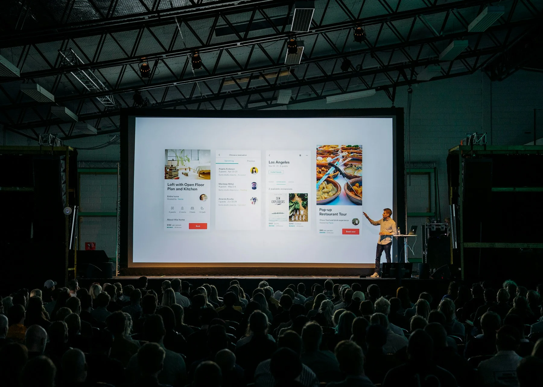 A conference audience gathered for a business presentation